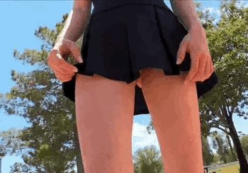 A teen lifts her skirt to do a pussy Flash Gif 