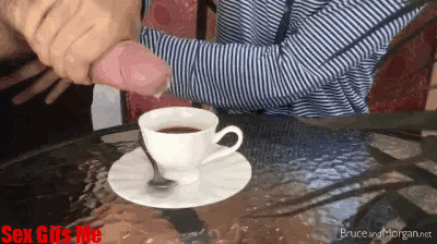 A girl gives her fella a handjob so that his cum goes into her morning coffee.