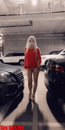 A blonde girl likes to keep safe from catching Covid when she goes naked in a car park.