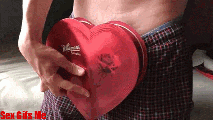 A man shows his love for his girlfriend by giving her heart shaped present with his big dick in it.