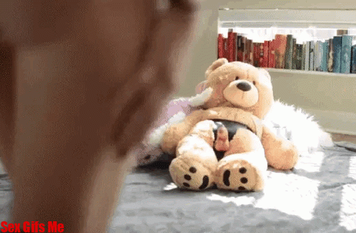 A teen girl gets ready to fuck her teddy bear by taking off her white panties.