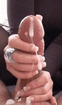 A girl gives a man a hand job and his cum makes a terrible mess all over the girls fingers.